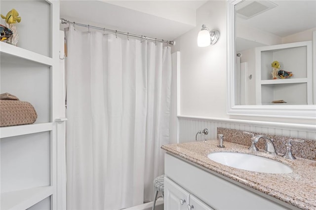 583 Highland Rd, Tiverton, RI 02878 - bathroom featuring vanity and wainscoting