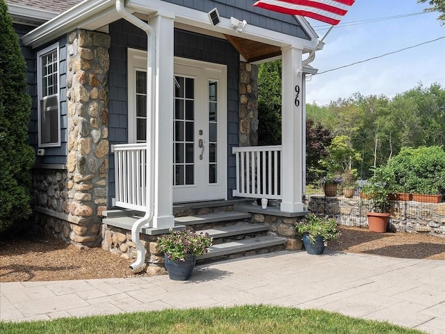 96 Ashaway Rd, Westerly, RI 02891 - view of exterior entry with stone siding, covered porch, and french doors