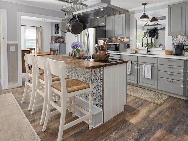 96 Ashaway Rd, Westerly, RI 02891 - kitchen featuring gray cabinetry, appliances with stainless steel finishes, light wood-type flooring, backsplash, and wainscoting