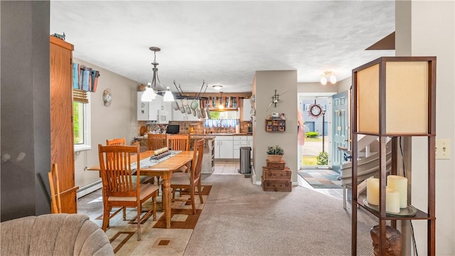 36 Primrose Ln Unit 36, North Providence, RI 02904 - dining space featuring plenty of natural light, light carpet, and a baseboard heating unit