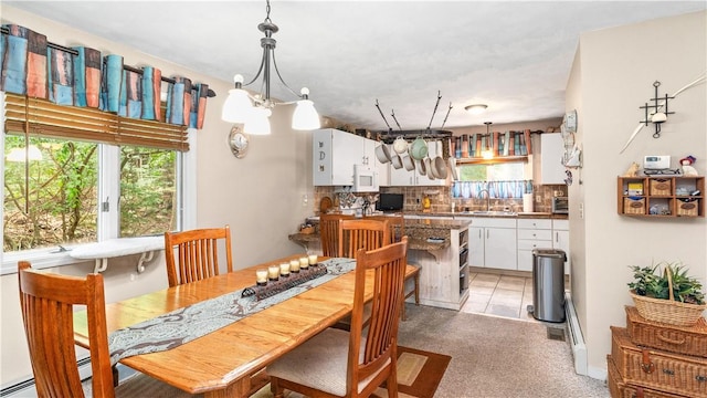 36 Primrose Ln Unit 36, North Providence, RI 02904 - dining space with a chandelier and light colored carpet