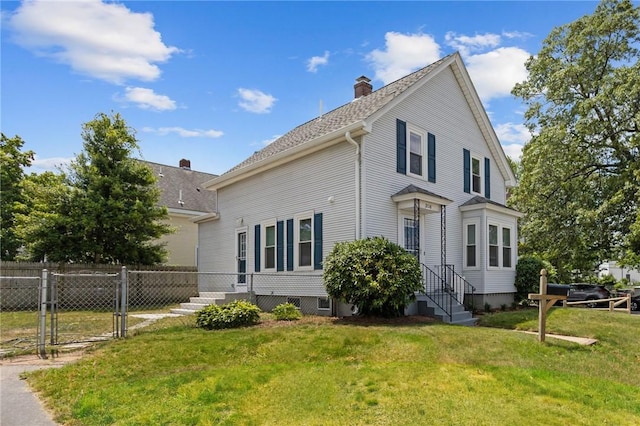 358 Pawtuxet Ave, Warwick, RI 02888 - view of home's exterior featuring a chimney and a gate