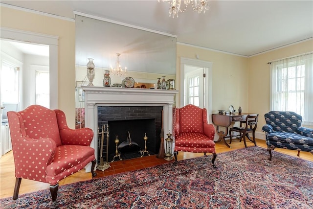 65 Lyndhurst Ave, Providence, RI 02908 - sitting room with a chandelier, plenty of natural light, wood finished floors, crown molding, and a brick fireplace