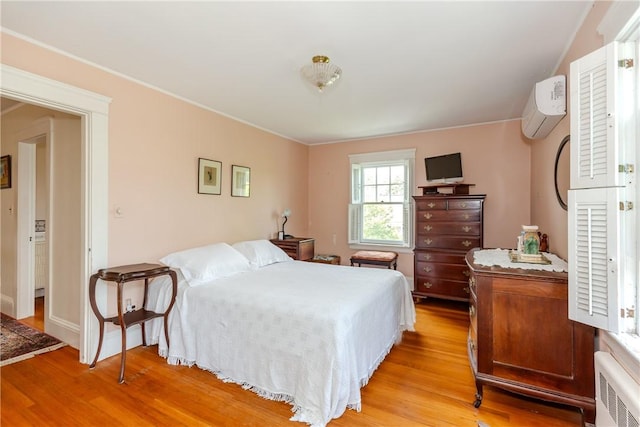 65 Lyndhurst Ave, Providence, RI 02908 - bedroom featuring a wall mounted AC and light wood-type flooring