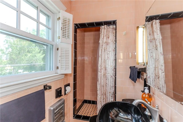 65 Lyndhurst Ave, Providence, RI 02908 - bathroom with tile walls, tiled shower, and healthy amount of natural light