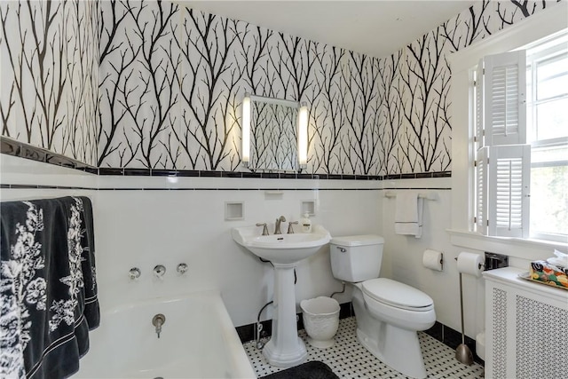 65 Lyndhurst Ave, Providence, RI 02908 - full bathroom featuring wallpapered walls, a bathtub, and radiator heating unit