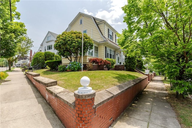65 Lyndhurst Ave, Providence, RI 02908 - dutch colonial with a gambrel roof and a front lawn