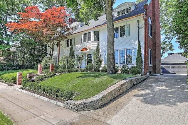 290 Blackstone Blvd, Providence, RI 02906 - american foursquare style home featuring a front lawn, a detached garage, and brick siding