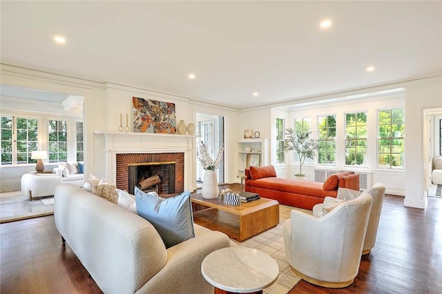 290 Blackstone Blvd, Providence, RI 02906 - living area with crown molding, a brick fireplace, wood finished floors, and recessed lighting
