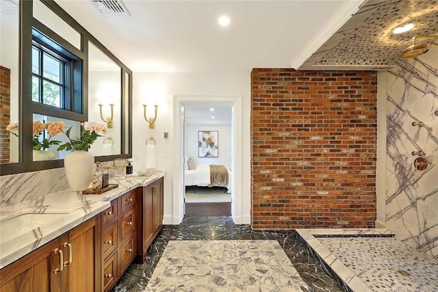 290 Blackstone Blvd, Providence, RI 02906 - full bath featuring marble look tile flooring, double vanity, brick wall, and ensuite bath