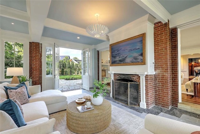290 Blackstone Blvd, Providence, RI 02906 - living room featuring beam ceiling, healthy amount of natural light, a fireplace with flush hearth, a chandelier, and crown molding
