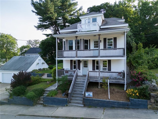 27 May St, Blackstone, MA 01504 - view of front of property featuring a balcony, covered porch, a garage, stairs, and a shingled roof