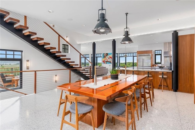 82 Nonquit Ln, Tiverton, RI 02878 - dining space featuring dark speckled floor and stairs