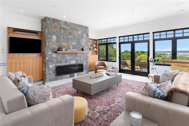 82 Nonquit Ln, Tiverton, RI 02878 - living room with a fireplace, recessed lighting, and built in shelves
