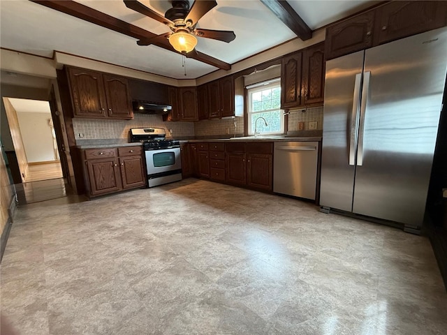 26 Flora Ave, Woonsocket, RI 02895 - kitchen with stainless steel appliances, under cabinet range hood, decorative backsplash, ceiling fan, and dark brown cabinetry