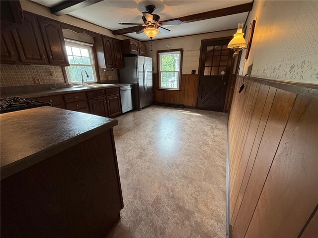 26 Flora Ave, Woonsocket, RI 02895 - kitchen featuring stainless steel appliances, plenty of natural light, wainscoting, light floors, and dark countertops