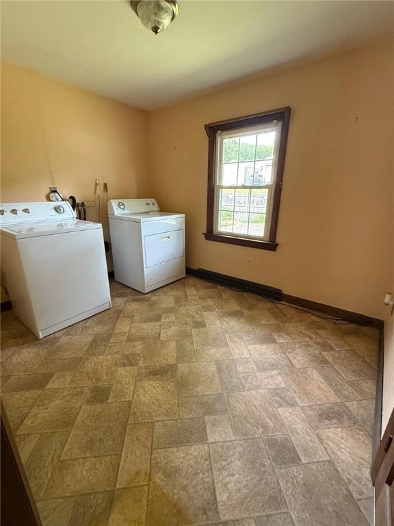 26 Flora Ave, Woonsocket, RI 02895 - laundry room featuring washer and dryer and stone finish floors