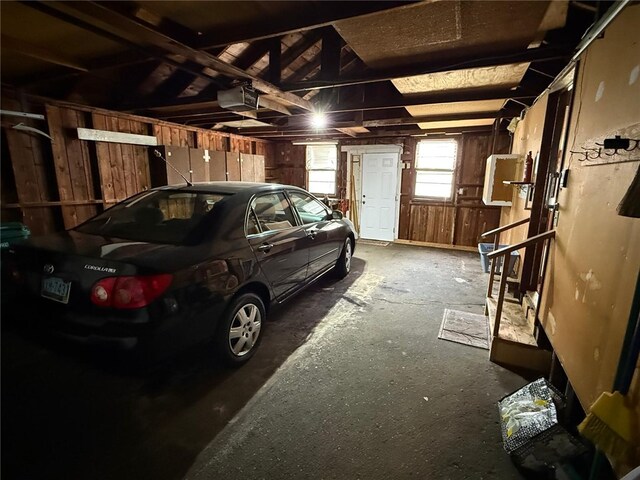 26 Flora Ave, Woonsocket, RI 02895 - garage featuring a garage door opener