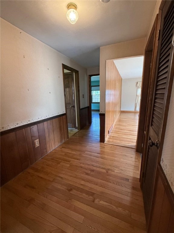 26 Flora Ave, Woonsocket, RI 02895 - hallway featuring wood finished floors, wainscoting, and wooden walls