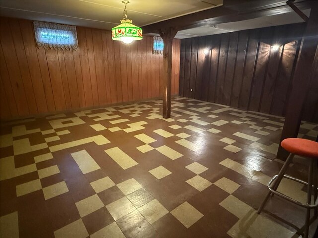 26 Flora Ave, Woonsocket, RI 02895 - below grade area featuring tile patterned floors and wooden walls