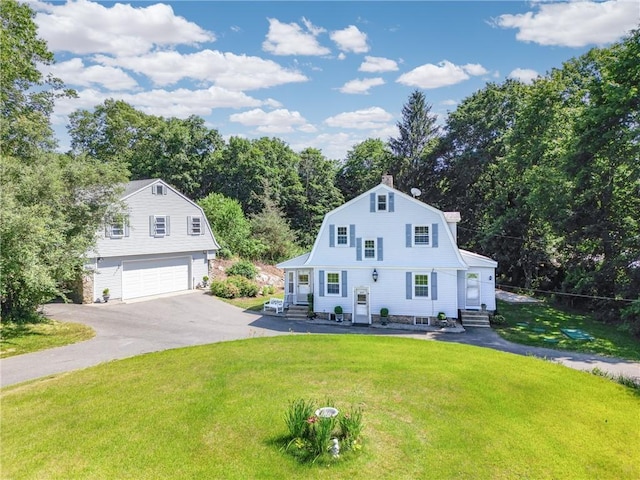 355 Scott Rd, Cumberland, RI 02864 - dutch colonial featuring a gambrel roof, driveway, a front yard, a garage, and entry steps