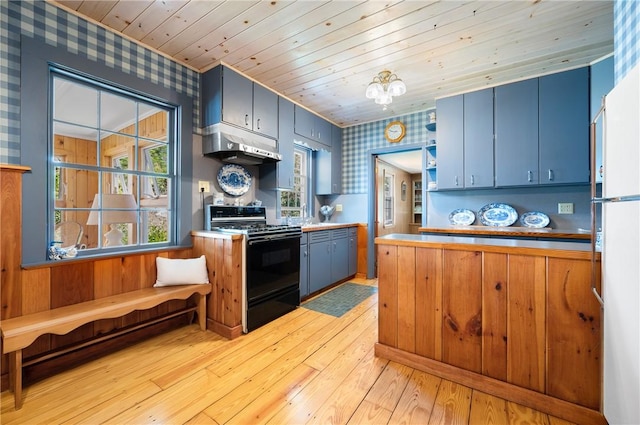 355 Scott Rd, Cumberland, RI 02864 - kitchen featuring black range, under cabinet range hood, wallpapered walls, blue cabinets, and wood ceiling