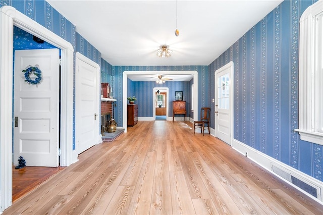 355 Scott Rd, Cumberland, RI 02864 - living room with wallpapered walls, wood finished floors, and ceiling fan