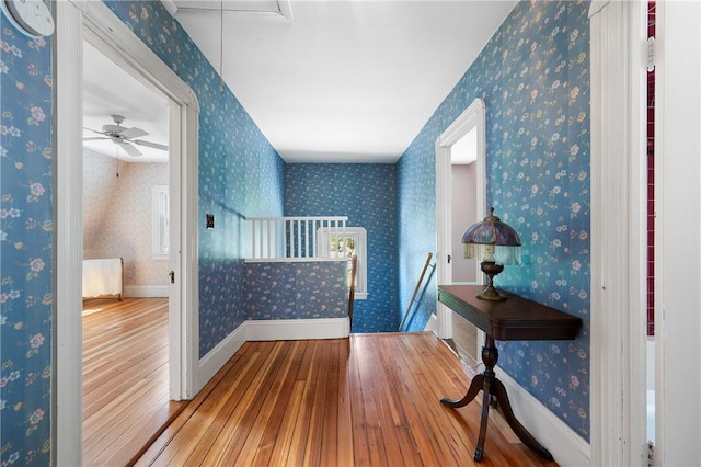 355 Scott Rd, Cumberland, RI 02864 - hallway with hardwood / wood-style flooring, attic access, an upstairs landing, and wallpapered walls