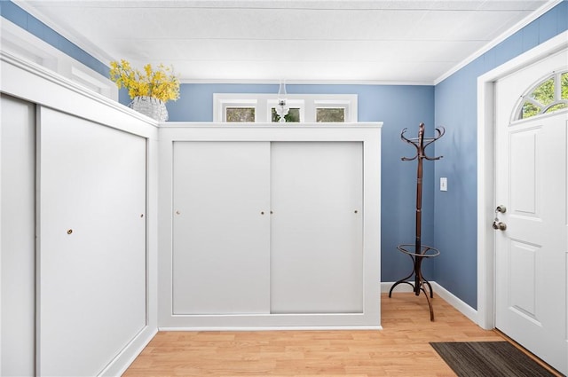 355 Scott Rd, Cumberland, RI 02864 - entrance foyer featuring light wood-style flooring, ornamental molding, and a chandelier