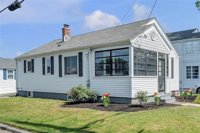 60 Hazael St, Providence, RI 02908 - view of side of home with a chimney, a lawn, and entry steps