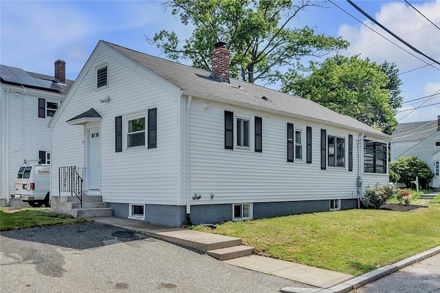 60 Hazael St, Providence, RI 02908 - view of front of home with a front lawn and a chimney