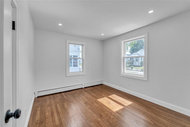 60 Hazael St, Providence, RI 02908 - unfurnished room featuring baseboard heating, wood finished floors, and recessed lighting