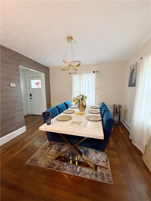 26 Westmore St, Providence, RI 02910 - dining area featuring a baseboard radiator, a chandelier, and wood finished floors