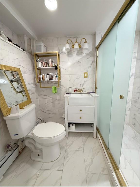 26 Westmore St, Providence, RI 02910 - full bathroom with a baseboard radiator, marble finish flooring, vanity, a stall shower, and tile walls