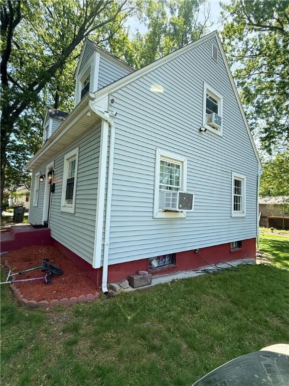 26 Westmore St, Providence, RI 02910 - view of property exterior featuring cooling unit and a lawn