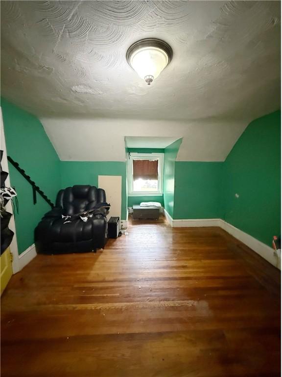 26 Westmore St, Providence, RI 02910 - additional living space featuring vaulted ceiling and wood finished floors