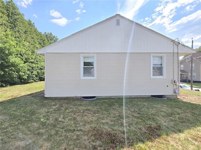 84 Bernice Ave, Woonsocket, RI 02895 - view of side of home featuring a lawn