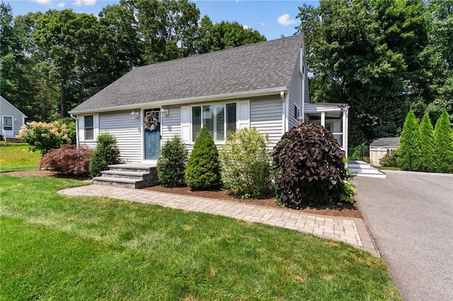 32 Spencer Rd, Smithfield, RI 02828 - view of front facade featuring a shingled roof and a front yard