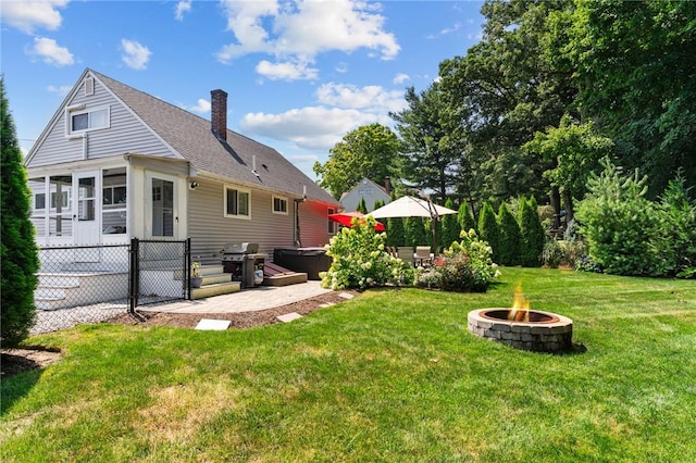 32 Spencer Rd, Smithfield, RI 02828 - back of property with a chimney, a patio area, a fire pit, and roof with shingles
