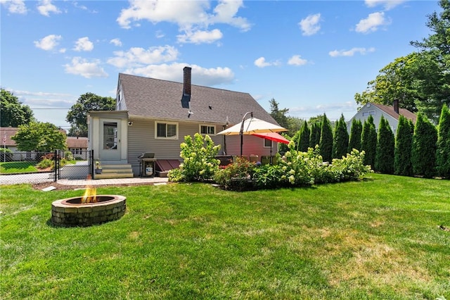 32 Spencer Rd, Smithfield, RI 02828 - rear view of house with a fire pit and a chimney