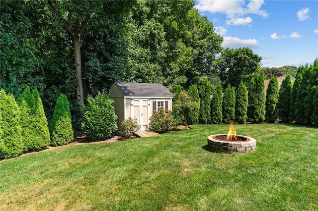 32 Spencer Rd, Smithfield, RI 02828 - view of green lawn featuring an outdoor fire pit and a shed