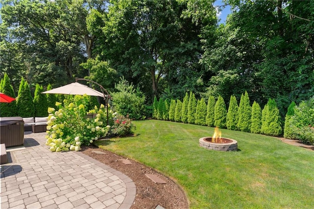 32 Spencer Rd, Smithfield, RI 02828 - view of grassy yard with a fire pit, a hot tub, and a patio