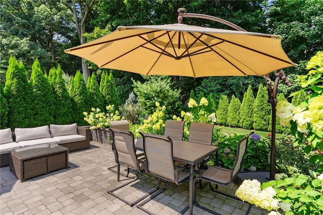 32 Spencer Rd, Smithfield, RI 02828 - view of patio with outdoor dining area, an outdoor living space, and view of wooded area