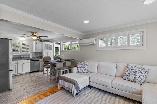 32 Spencer Rd, Smithfield, RI 02828 - living area with a wall unit AC, healthy amount of natural light, crown molding, recessed lighting, and light wood-style floors