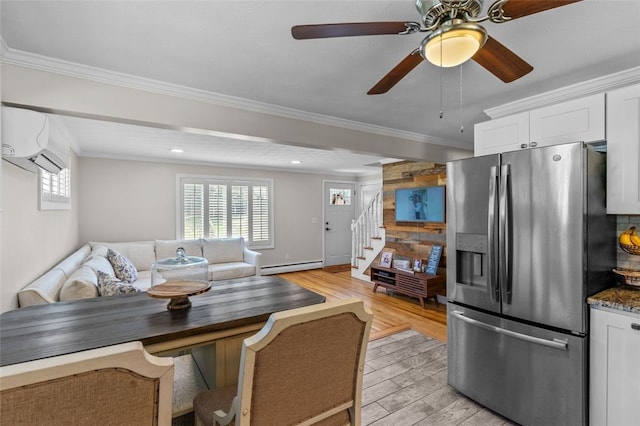 32 Spencer Rd, Smithfield, RI 02828 - dining area with a baseboard radiator, plenty of natural light, light wood-style floors, stairway, and crown molding