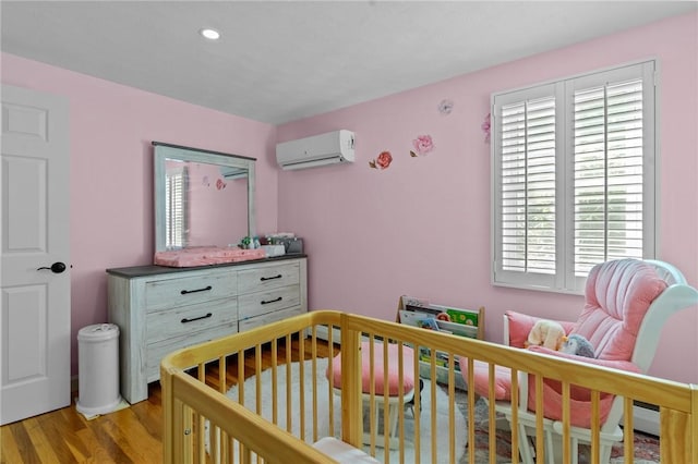 32 Spencer Rd, Smithfield, RI 02828 - bedroom with a wall unit AC, multiple windows, wood finished floors, and recessed lighting