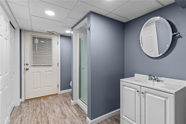 32 Spencer Rd, Smithfield, RI 02828 - full bathroom featuring a shower stall, vanity, wood finished floors, and a drop ceiling