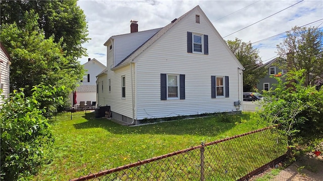 61 Terrace Ave, Pawtucket, RI 02860 - back of house featuring a chimney and a fenced backyard