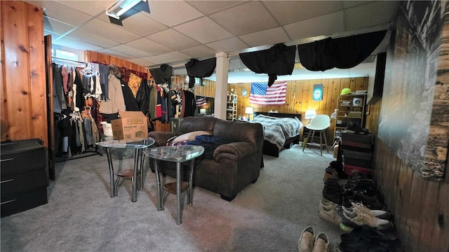 61 Terrace Ave, Pawtucket, RI 02860 - carpeted bedroom with wooden walls and a drop ceiling