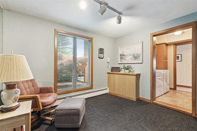 4 Wilbur Rd, Lincoln, RI 02865 - living area with washer and dryer, dark colored carpet, track lighting, and baseboard heating